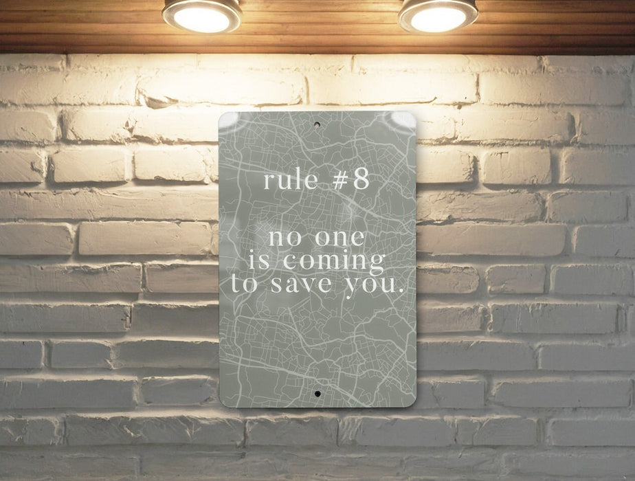 a sign on a brick wall that says rules 8 no one is coming to save