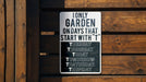 a sign on a wooden fence that says only garden on days that start with t