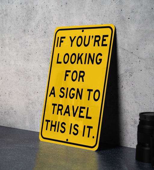 a yellow sign that says if you're looking for a sign to travel this