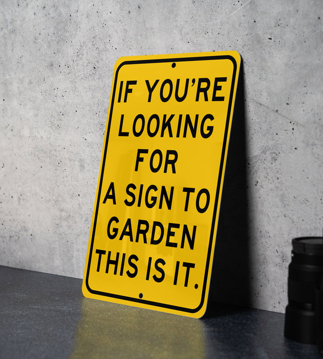 a yellow sign that says if you're looking for a sign to garden this