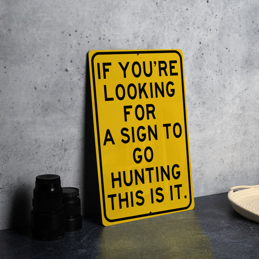 a yellow sign that says if you're looking for a sign to go hunting