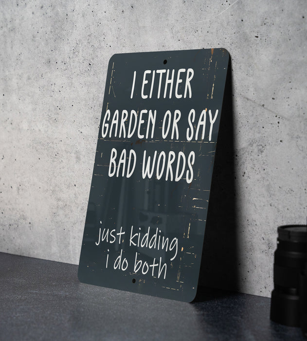 a sign that says i either garden or say bad words just kidding i do
