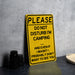 a yellow sign sitting on top of a table