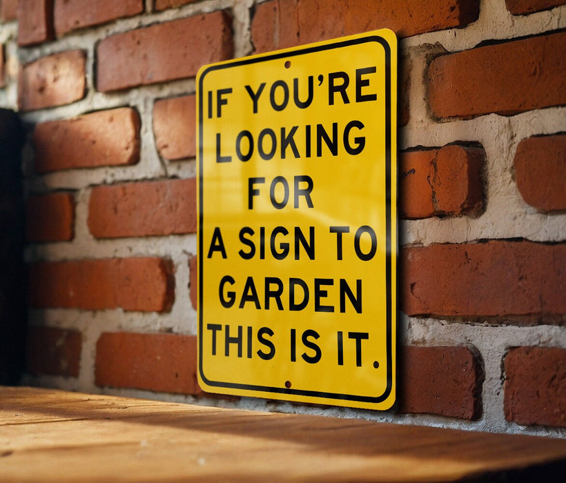 a yellow sign on a brick wall saying if you're looking for a sign