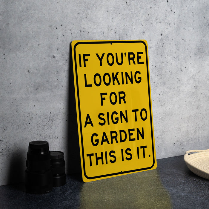 a yellow sign that says if you're looking for a sign to garden this