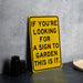 a yellow sign that says if you're looking for a sign to garden this