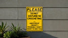 a yellow sign that says please don't disturb i'm crocheting