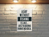 a sign on a brick wall that says a day without fishing is like just kidd