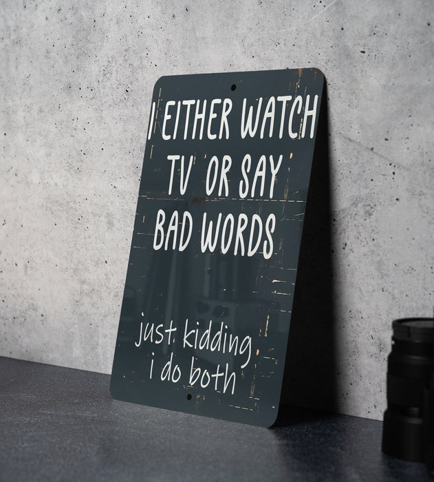 a sign on a table that says, i either watch tv or say bad words