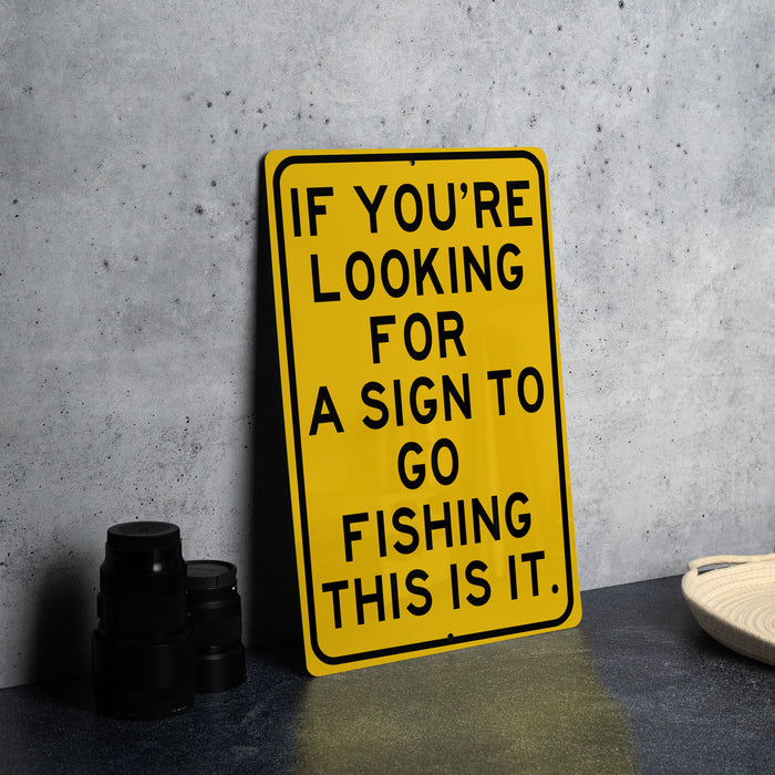 a yellow sign that says if you're looking for a sign to go fishing