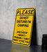 a yellow sign sitting on top of a table