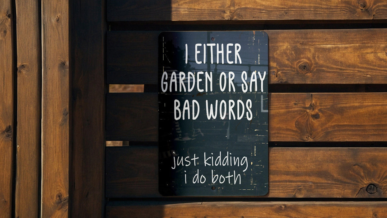 a sign on a wooden fence that says i either garden or say bad words