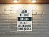 a sign on a brick wall that says a day without baking is like just kidd