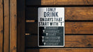 a sign on a wooden fence that says only drink on days that start with t