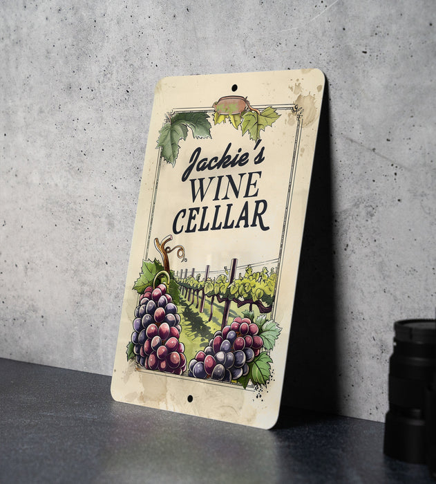a wine cellar sign with grapes on it