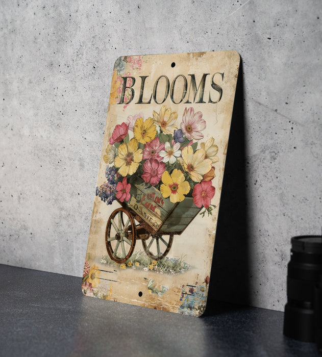 a wooden sign with flowers on it sitting on a table