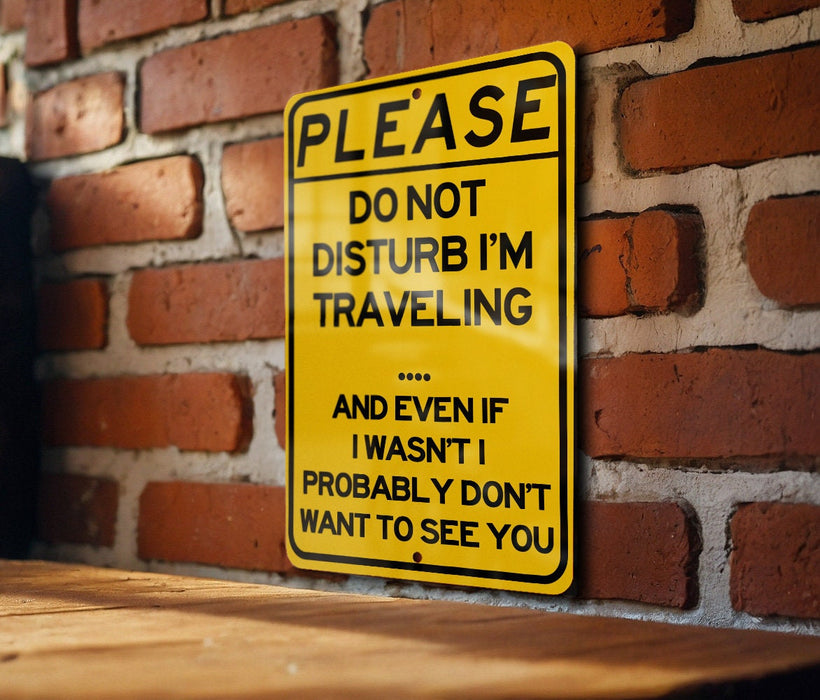 a yellow sign on a brick wall that says please don't disturb i '