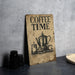 a coffee time sign sitting on top of a table