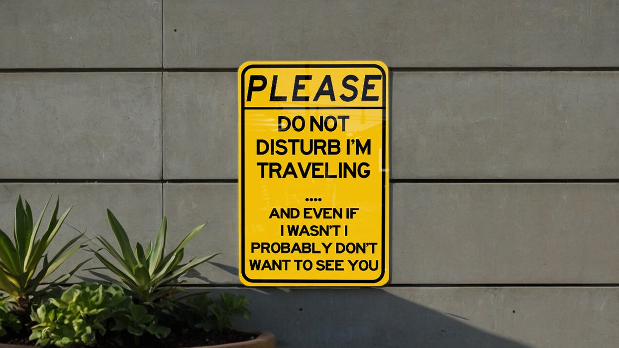 a yellow sign that says please don't disturb i'm traveling and even