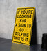 a yellow sign sitting on top of a table
