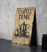 a coffee time sign sitting on top of a table