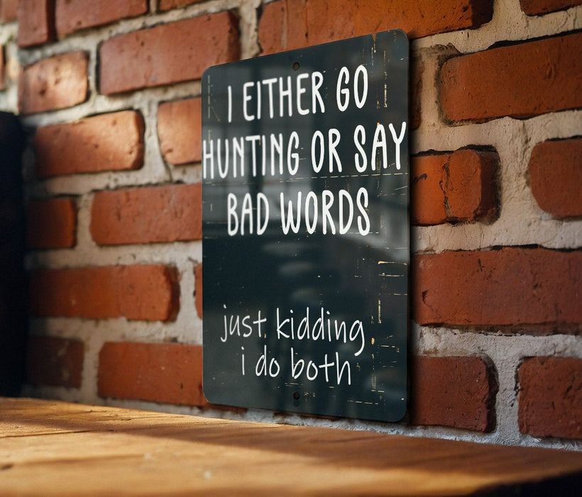 a sign on a brick wall that says i either go hunting or say bad words