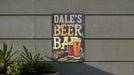 a sign on the side of a building that says dale's beer bar