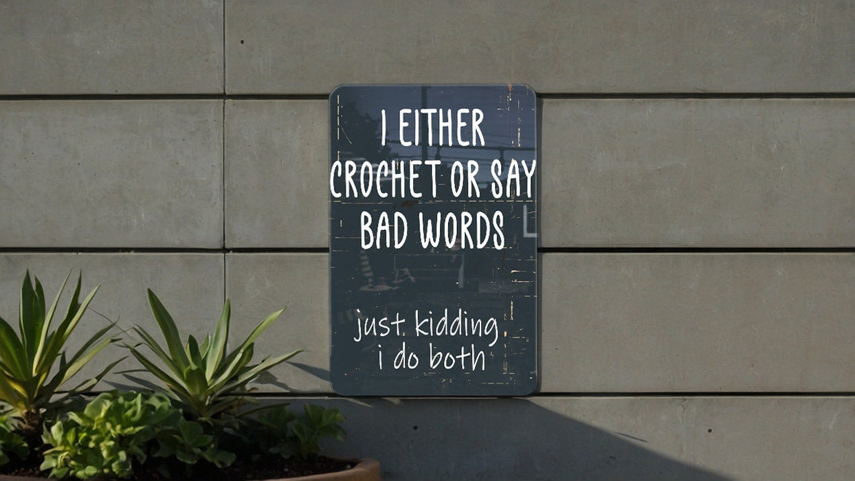a sign on a wall that says i either crochet or say bad words