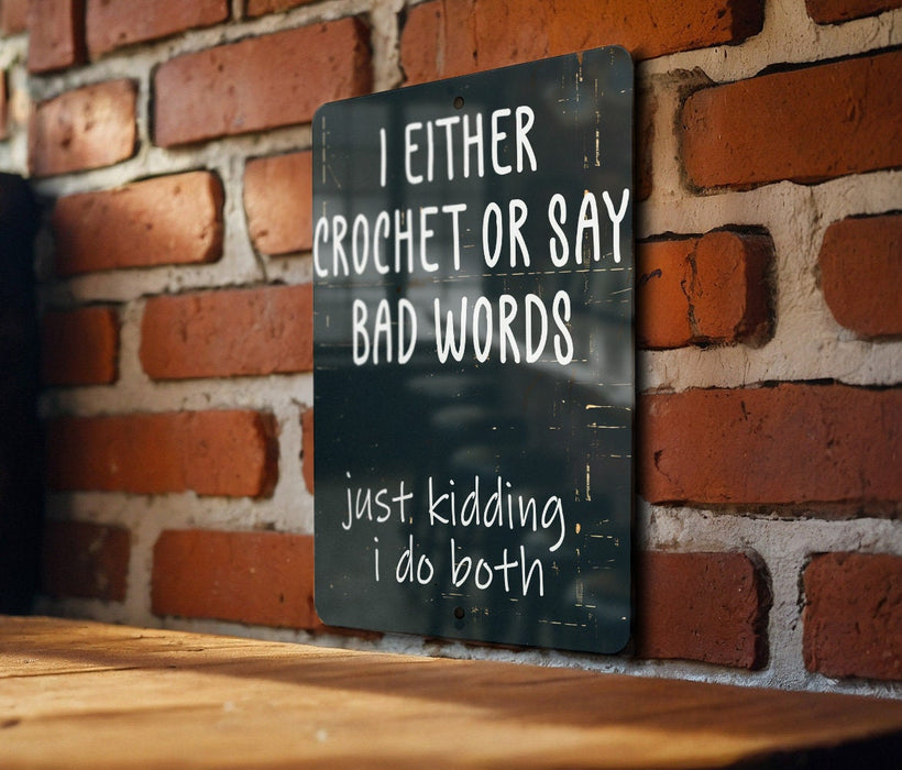 a sign on a brick wall that says i either crochet or say bad