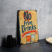 a no free drinks sign sitting on a table