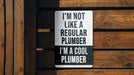 a sign that says i'm not like a regular plumber i'm