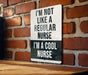 a sign on a brick wall that says i'm not like a regular nurse