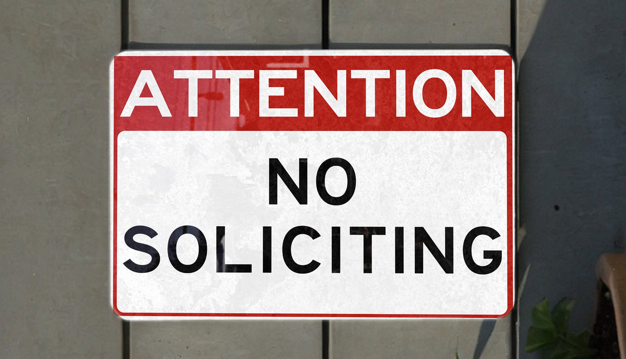 a red and white sign that says no parking