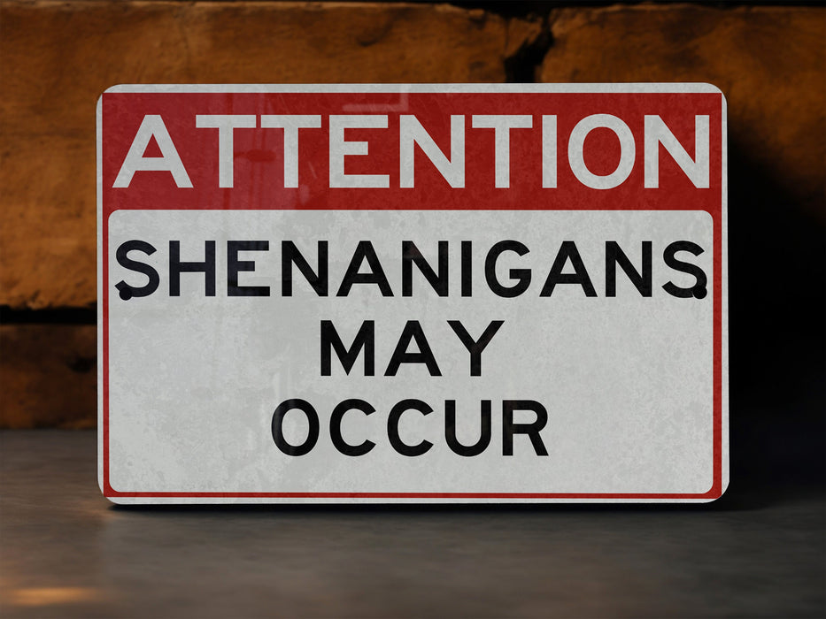 a red and white sign that says attention shenanngans may occur