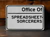 a white sign that says office of spreadsheet sorcers