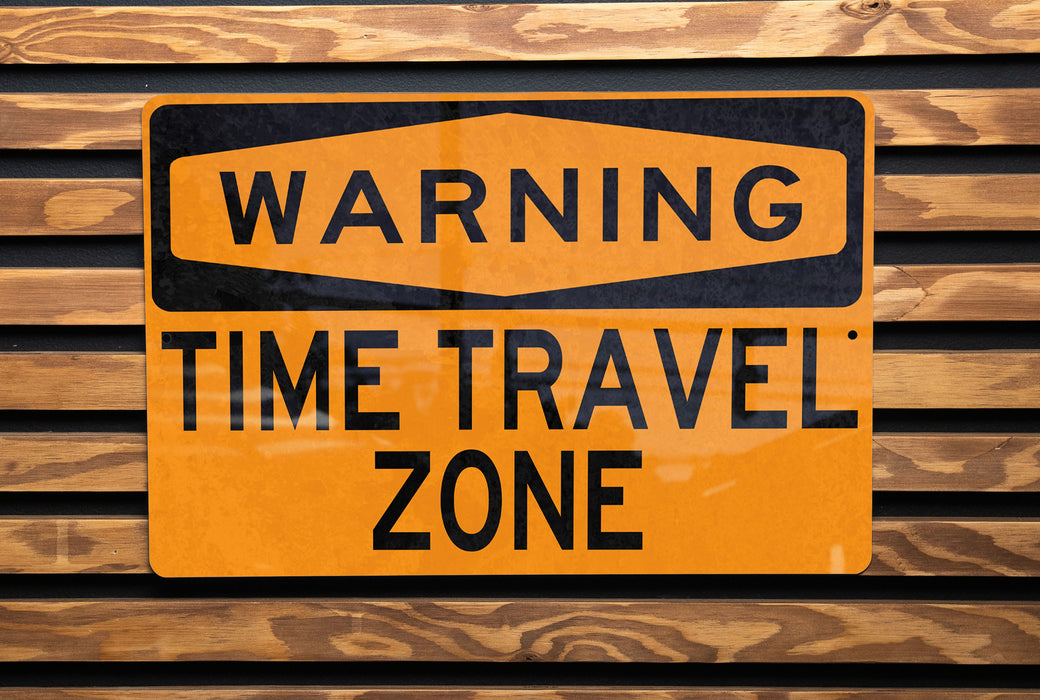 a close up of a street sign on a wooden surface