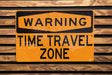 a close up of a street sign on a wooden surface