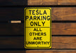 a yellow sign that says tesla parking only all others are unworthyly