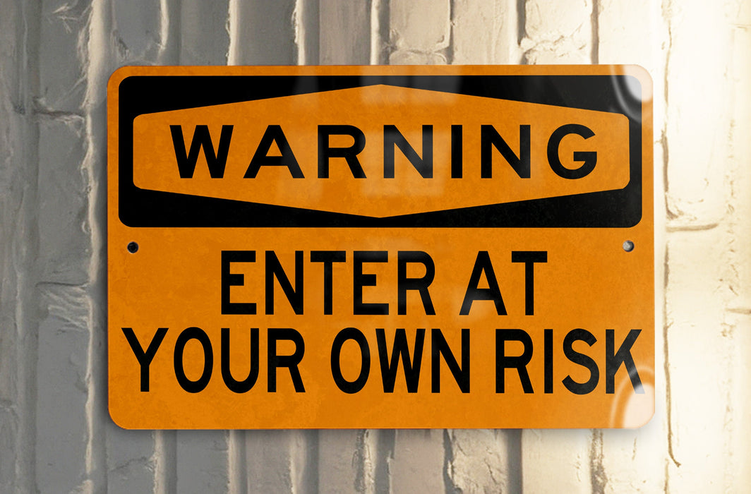 a yellow and black street sign on a pole