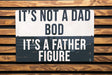 a black and white sign on a wooden wall