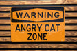 a yellow sign on a wooden wall that says zone