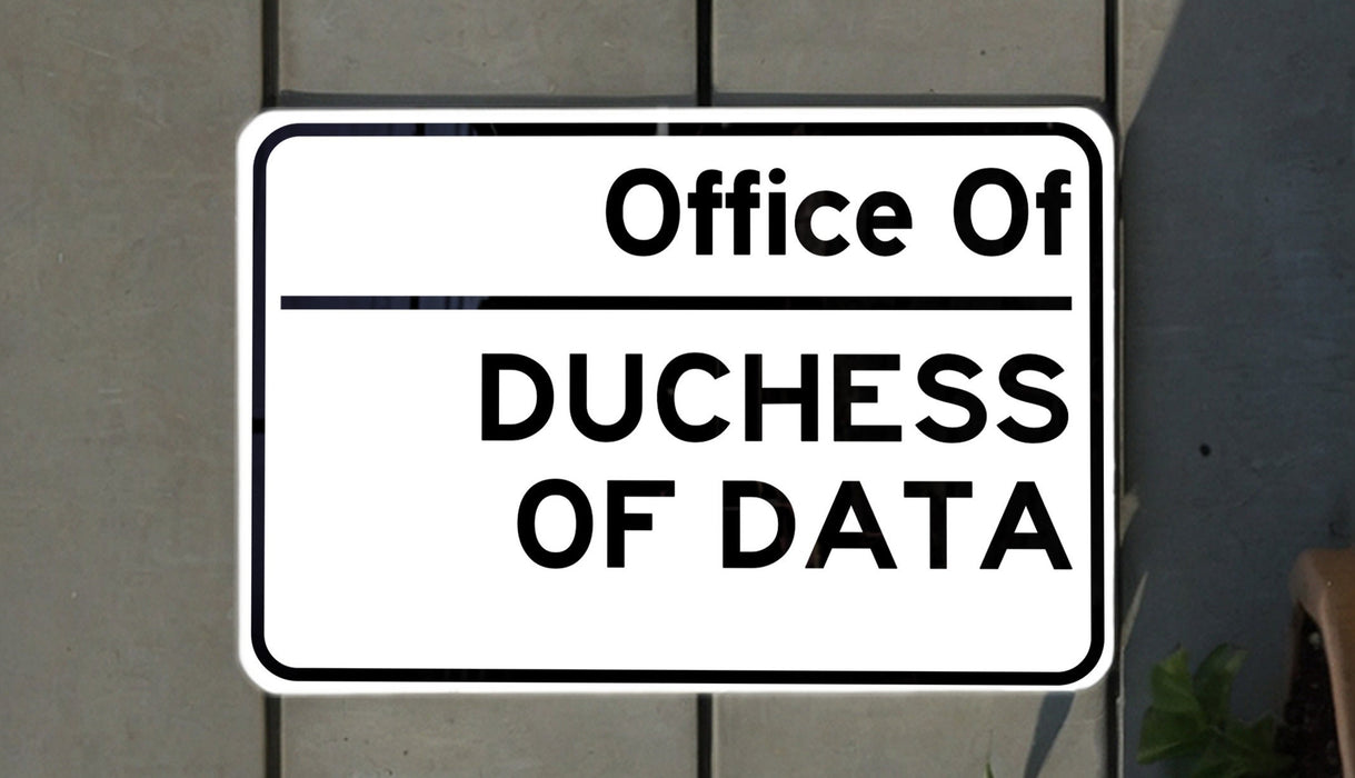 a white sign with black lettering on it