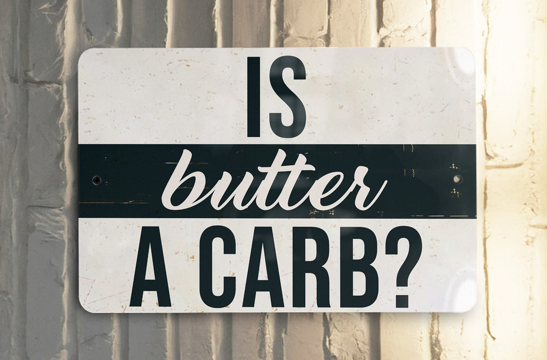 a white and black street sign hanging on a wall