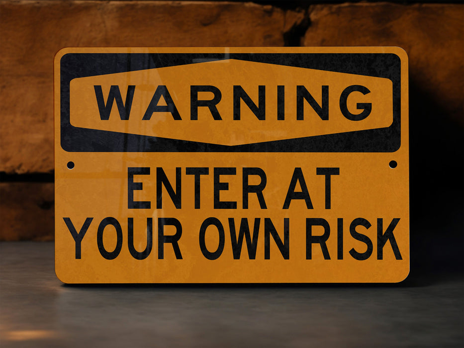 a yellow warning sign on a concrete floor