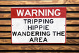 a red and white sign on a wooden bench