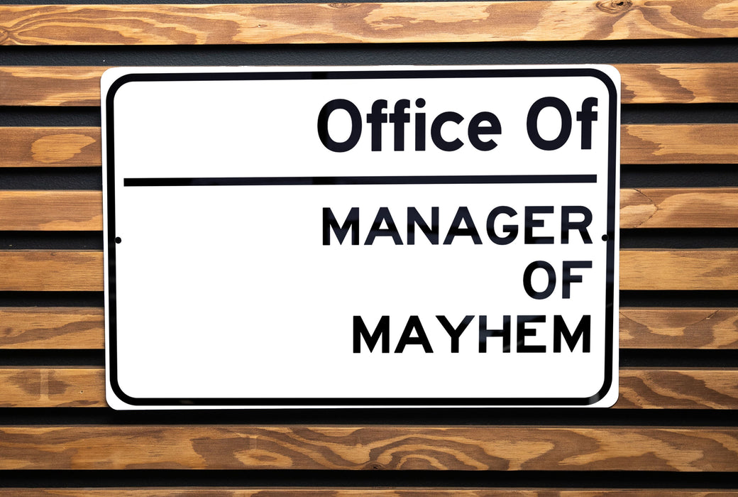 a close up of a street sign on a wooden bench