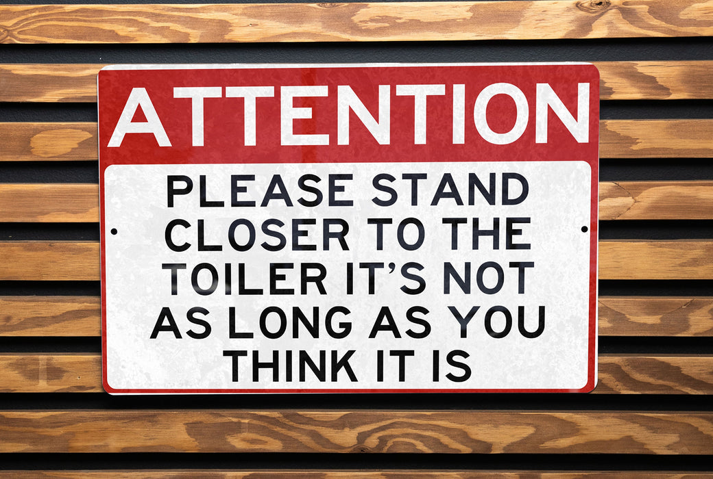 a red and white sign on a wooden wall