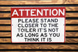 a red and white sign on a wooden wall