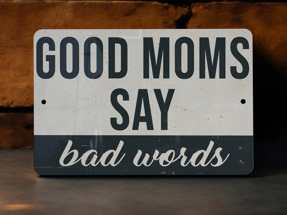 a sign that says good moms say bad words