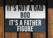 a black and white sign on a wooden fence